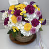 A vibrant and elegant floral arrangement featuring white hydrangeas, yellow chrysanthemums, and