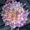 Beautiful bouquet with 75 roses in light pink and purple tones, purple