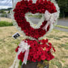 Open heart floral arrangement made up of 150 red roses, baby's breath