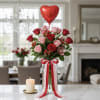One-dozen mixed red and pink rose, hypericum, cymbidium orchids arrangement in a