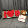 This elegant gift set features a stunning arrangement of fresh red roses