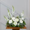 Simply elegant.  A crystal cross surrounded by white blooms is a