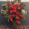 Beautiful red roses with baby's breath in large vase and bow