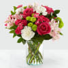 The sweet colors of hot pink roses, pale pink alstroemeria and more