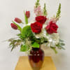 This Medium Arrangement Includes White Hydrangea's, Red Roses, Pink Snapdragons, Tulips, Green