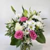 A charming bouquet of soft pink and creamy white petals mingled with