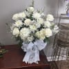 White roses, hydrangeas, small mums and greenery. 