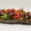 fall florals, textures, and greenery in a faux ceramic log