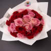 A captivating bouquet showcasing rich crimson and delicate pink blooms. This eye-catching