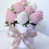 A vision in soft pink and ivory. This exquisite arrangement features hand-dipped
