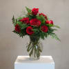 Elegant, romantic, and forever in style, this Classic Dozen Rose Arrangement features