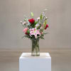 Bold yet beautifully balanced, this arrangement brings together timeless favorites with a