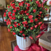 Brighten up a space with this lovely SILK  red rose bush