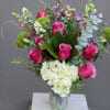 Purple roses, lisianthus, dianthus, hydrangea, blooming fillers, snap dragons, magnolia leaves, eucalyptus