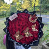 50 roses wrapped with a crown and butterflies 

Rose color available:
Red 
Pink
Hot