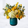 Radiate warmth and joy with the Fulgent Oasis floral arrangement. This stunning