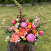 A Colorful arrangement in Sunset Hues of Pinks, Oranges, and Yellows using