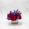 Beautiful deep Red Heart roses in a silver cube with filler. The