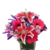 Vibrant hot pink gerberas and stargazer lilies with accents of purple in