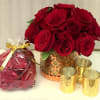 One stop shopping...roses arranges in a keepsake vessel, rose petals and votive