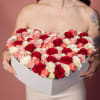 Meet the Crimson Heartbeat: a stunning heart-shaped arrangement overflowing with deep red