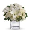 Surprise a faraway friend with this elegant array of Christmas flowers. White