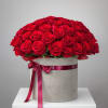 50 red roses in a large grey box