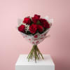A dozen red roses, hand-wrapped and finished with Valentine flair &mdash; simple