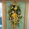 Beautiful yellow, blue and white floral mix to pay tribute to your