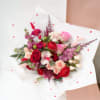A symphony of deep reds and soft pinks, the Love Song Bouquet
