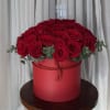 round hat box with approximately 50 premium roses in red or your