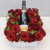 Feature your favorite bottle of bubbly surrounded lush red roses. Perfect for