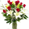 This Romantic Bouquet includes fresh white lilies and vibrant red roses. Accented