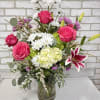A grand arrangement with hydrangea, stargazer lilies, roses, and daisies, 