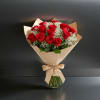 A timeless bouquet of 12 red roses, hand-tied and wrapped for an