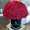 A gorgeous arrangement of red roses in our signature black box with