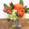 Ribbon tied cube vase with free spirit roses, hypericum, fatsia and hydrangeas