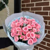 Pink Spray roses with eucalyptus in a bouquet
