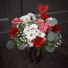 The Sweetheart Bouquet is a delightful mix of fresh, vibrant daisies and