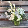 all white flowers include calla lilies, hydrangeas, orchids and others.