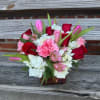 red roses, tulips (color based on availability), hydrangea, alstromeria