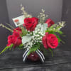 Roses are the highlight of this beautiful red rosey possy vase.