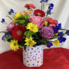 This colorful valentine arrangement will put a smile and light up your