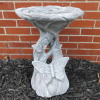 Solid concrete birdbath will look beautiful in the front or back yard.