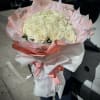 A wrapped bouquet of flowers is a beautifully arranged collection of blooms