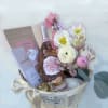 A celebration box with bubbly, chocolate, fresh flowers and a Liberty x