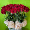 Two to four dozen red roses designed in a sleek topiary design.
