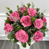 Romance redefined featuring a low and lush romantic dozen roses perfect for