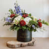 Theme Colors: Shades of red, whites and blues

Featured Blooms: Orchids, Daisies, Hydrangea