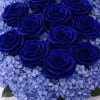 A dozen of blue Roses in with blue hydrangea and greenery in